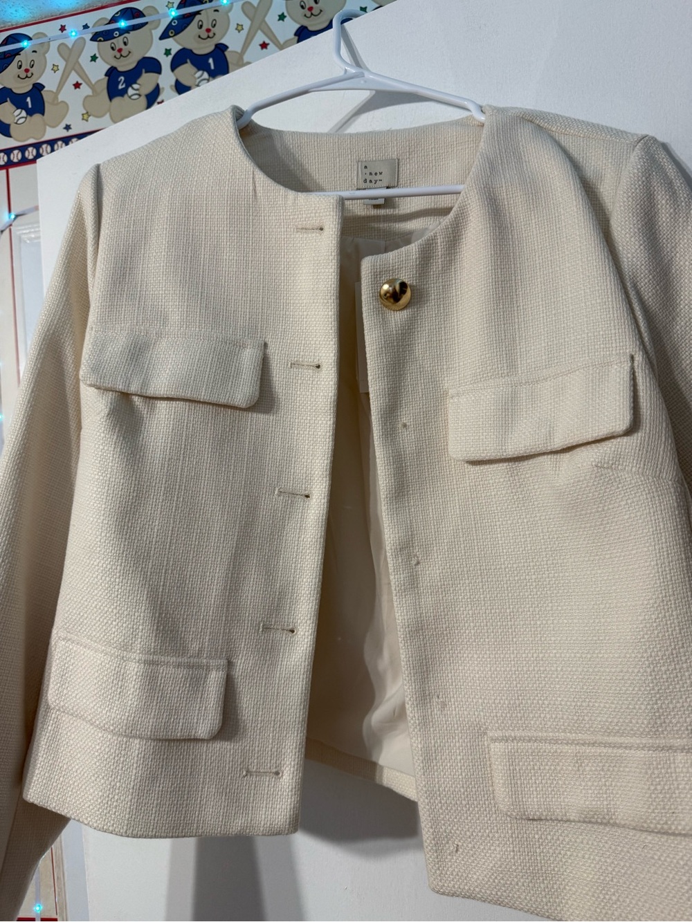 Cream Textured Collarless Jacket with Gold Accent